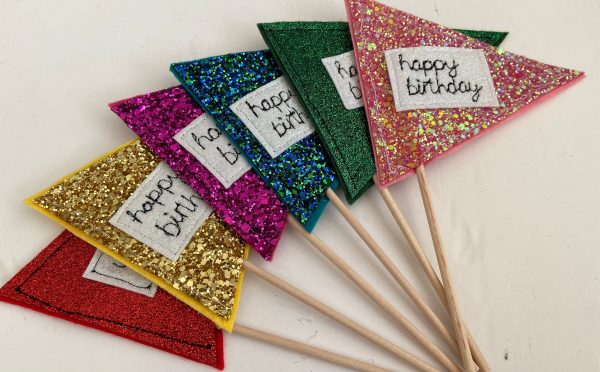 Cute personalised, chunky glitter birthday flags/ cake toppers. They can be personalised with a name or short message if you'd like.