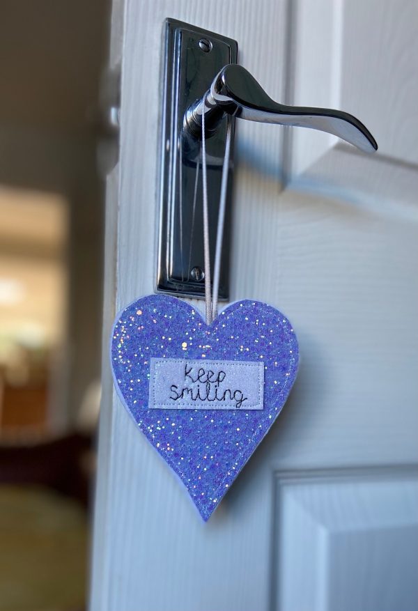 Handmade, personalised hanging glitter heart. Its ideal for a sweet little gift to pop inside a card for easy posting. It can be personalised with a name or short message.
